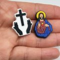 A Set Of 18 Jesus Croc Charms