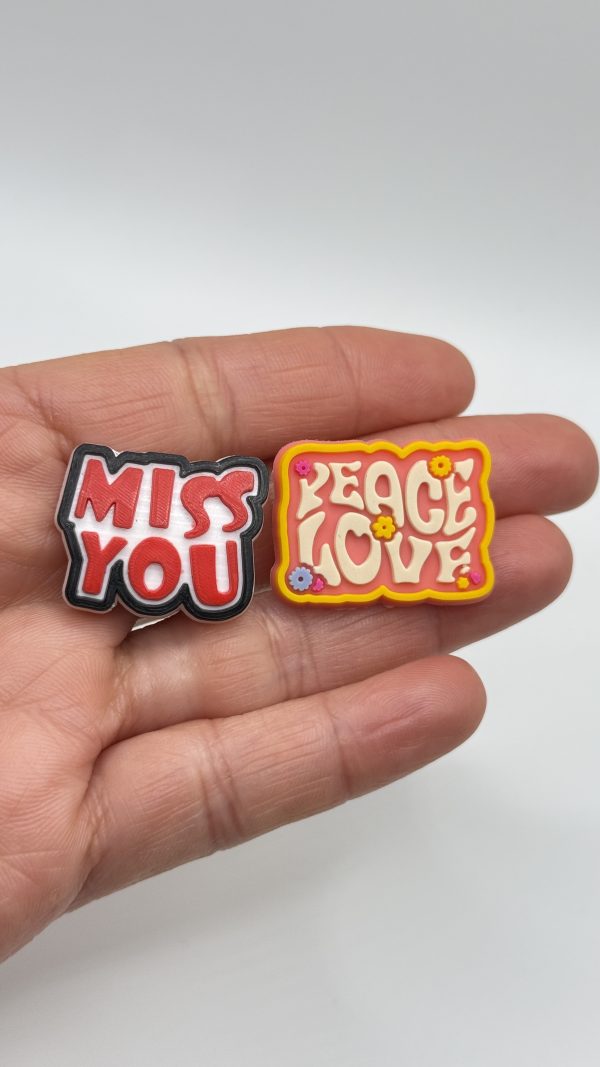 A Set Of 25 Love Heart Croc Charms