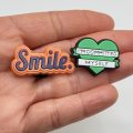 A Set Of 25 Love Heart Croc Charms