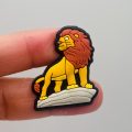 A Set Of 13 Lion King Croc Charms