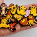 A Set Of 13 Lion King Croc Charms