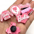 A Set Of 6 Barbie Croc Charms